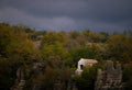 Stone chapel hidden among autumn trees, fine art print