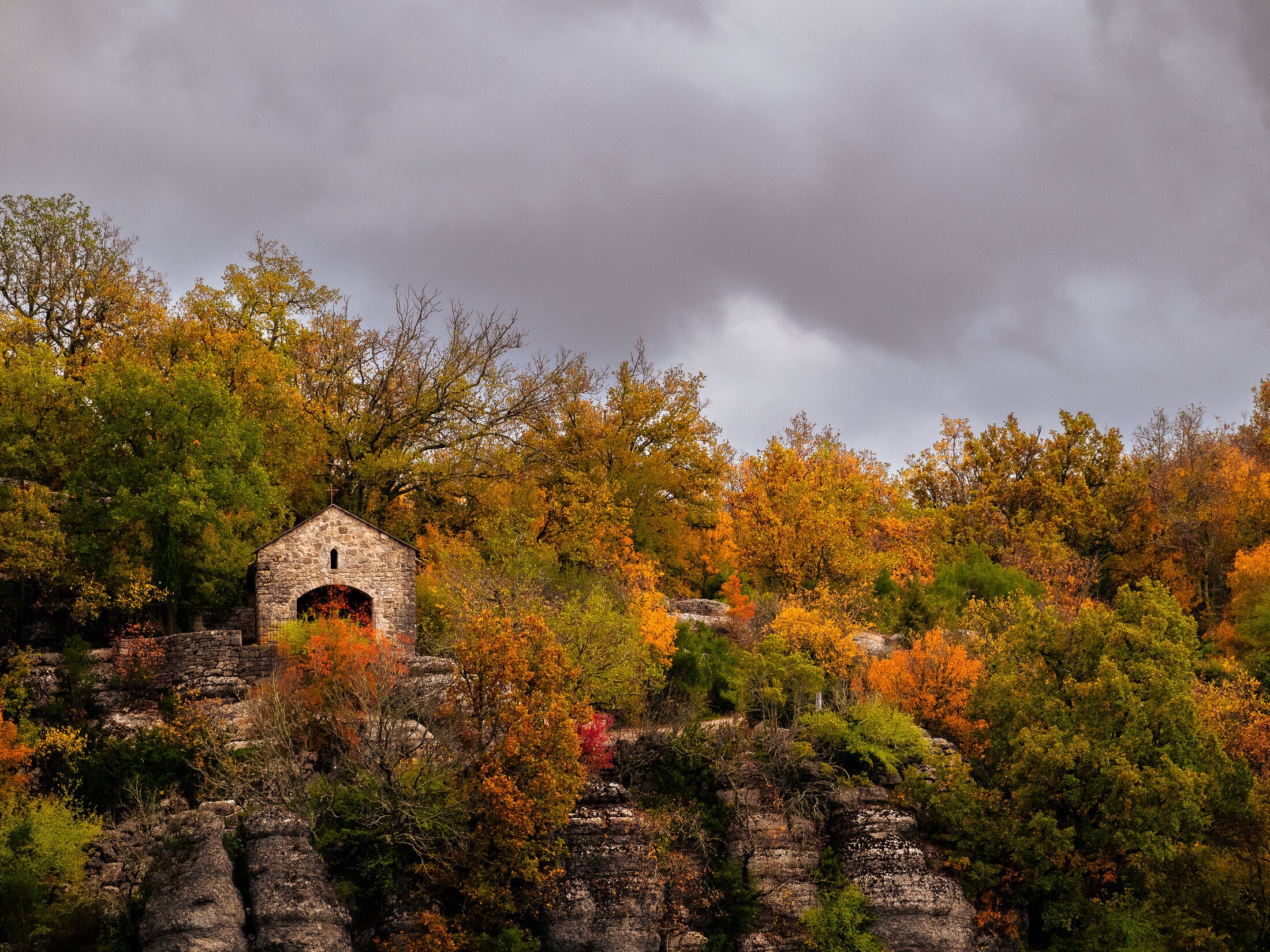 Stone chapel on a wooded autumn ridge, fine art print