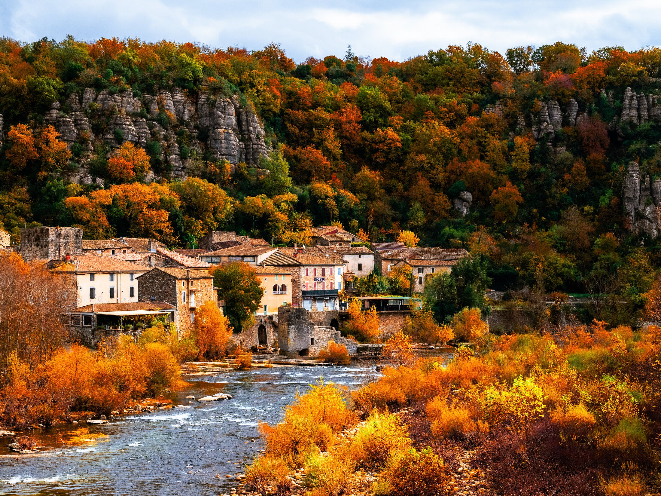 Riverside houses in autumn color, fine art print