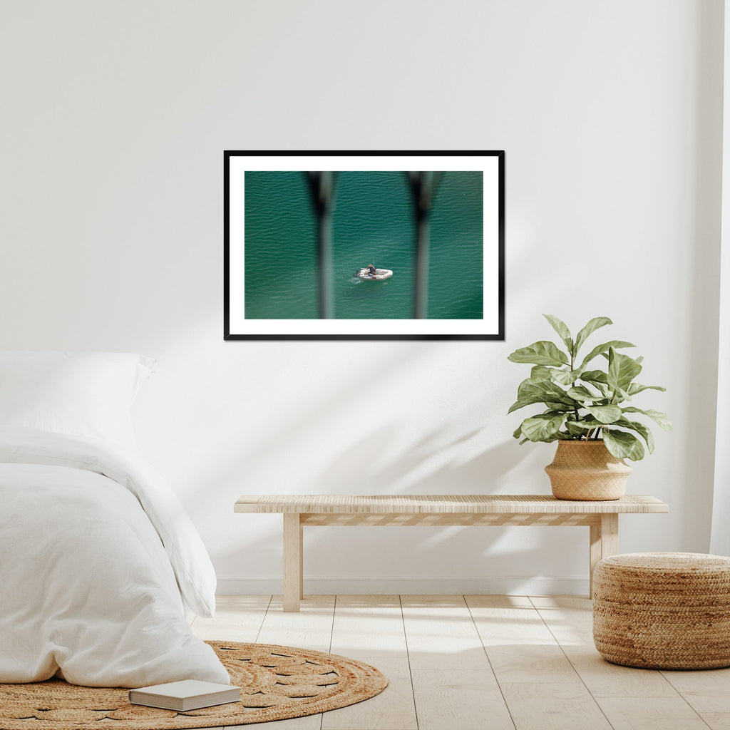 Small Boat, Big Sea fine art print displayed in a living room