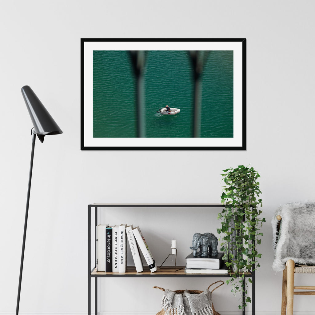 Small Boat, Big Sea fine art print displayed in a living room