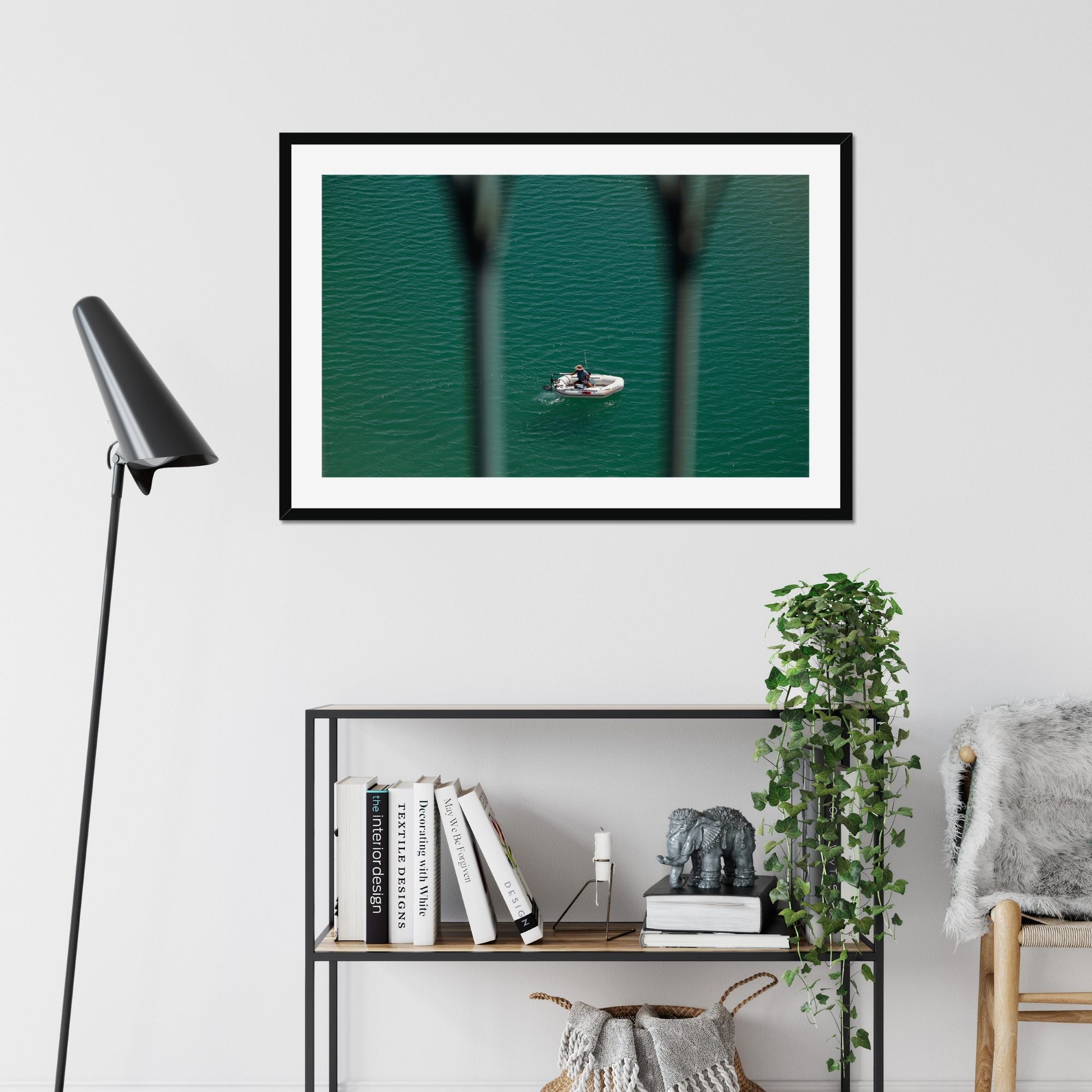 Small Boat, Big Sea fine art print displayed in a living room