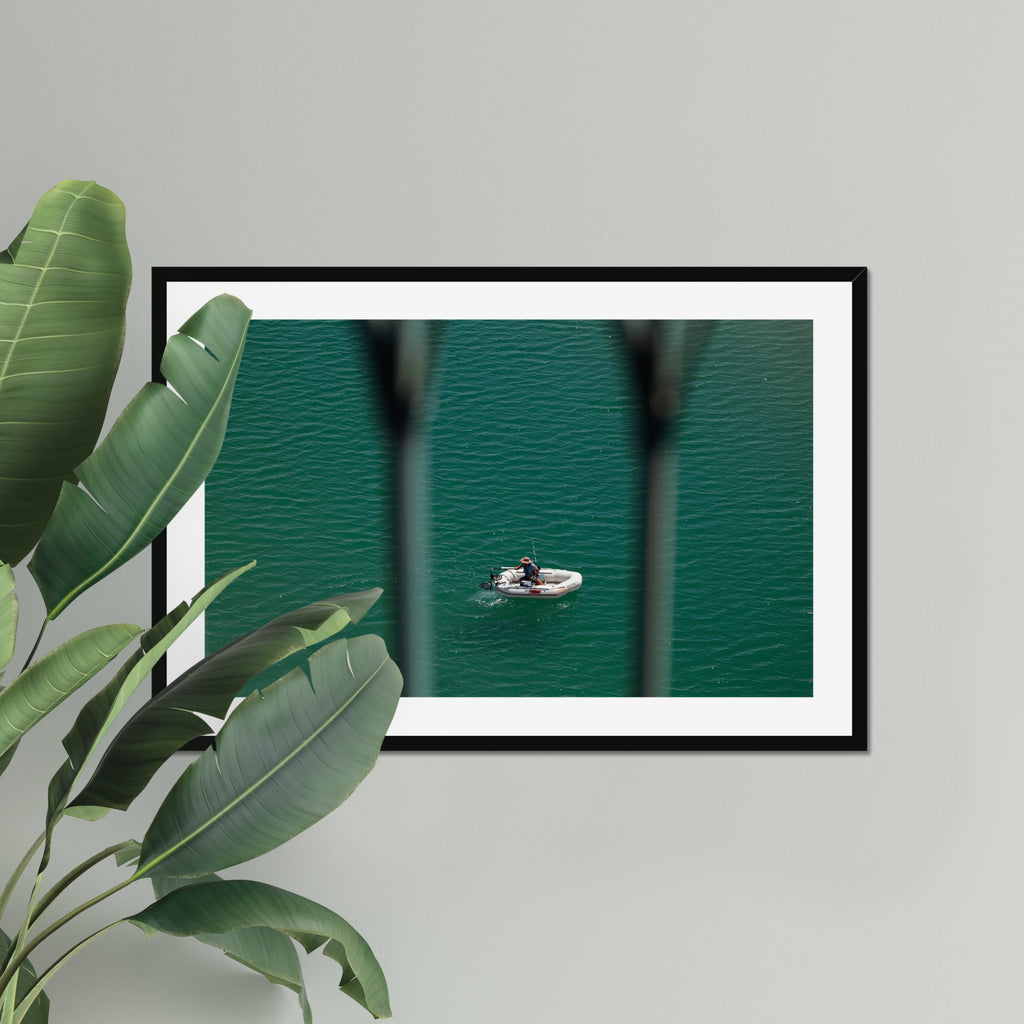 Small Boat, Big Sea fine art print displayed in a living room