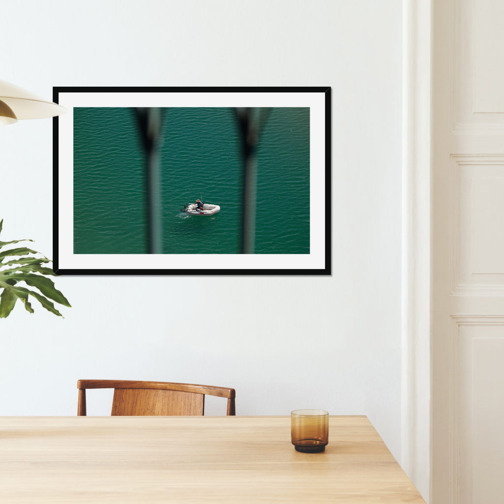 Small Boat, Big Sea fine art print displayed in a living room