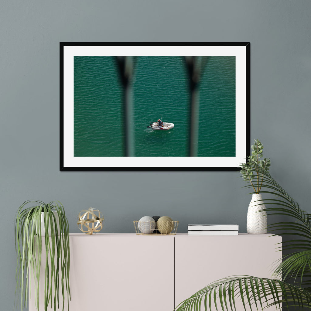 Small Boat, Big Sea fine art print displayed in a living room