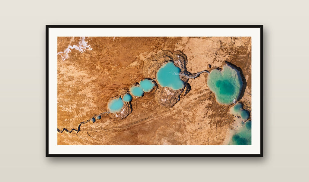 Turquoise Sinkholes fine art print mockup on a wall